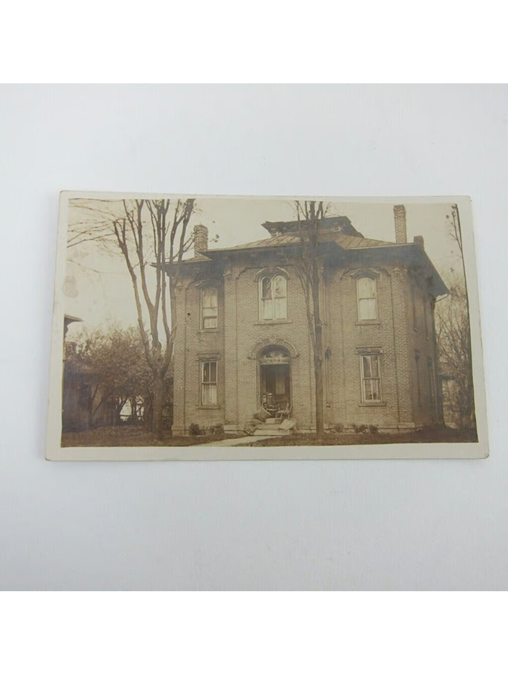 Real Photo Postcard RPPC Antique Brick House & Trees Rocking Chairs Front Porch